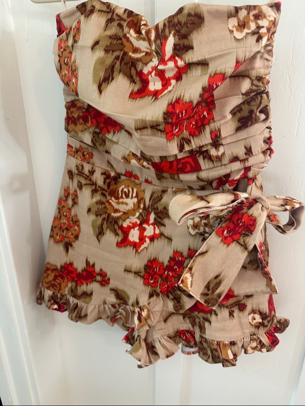Olivaceous Strapless Floral Tie-Waist Romper in Beige and Orange